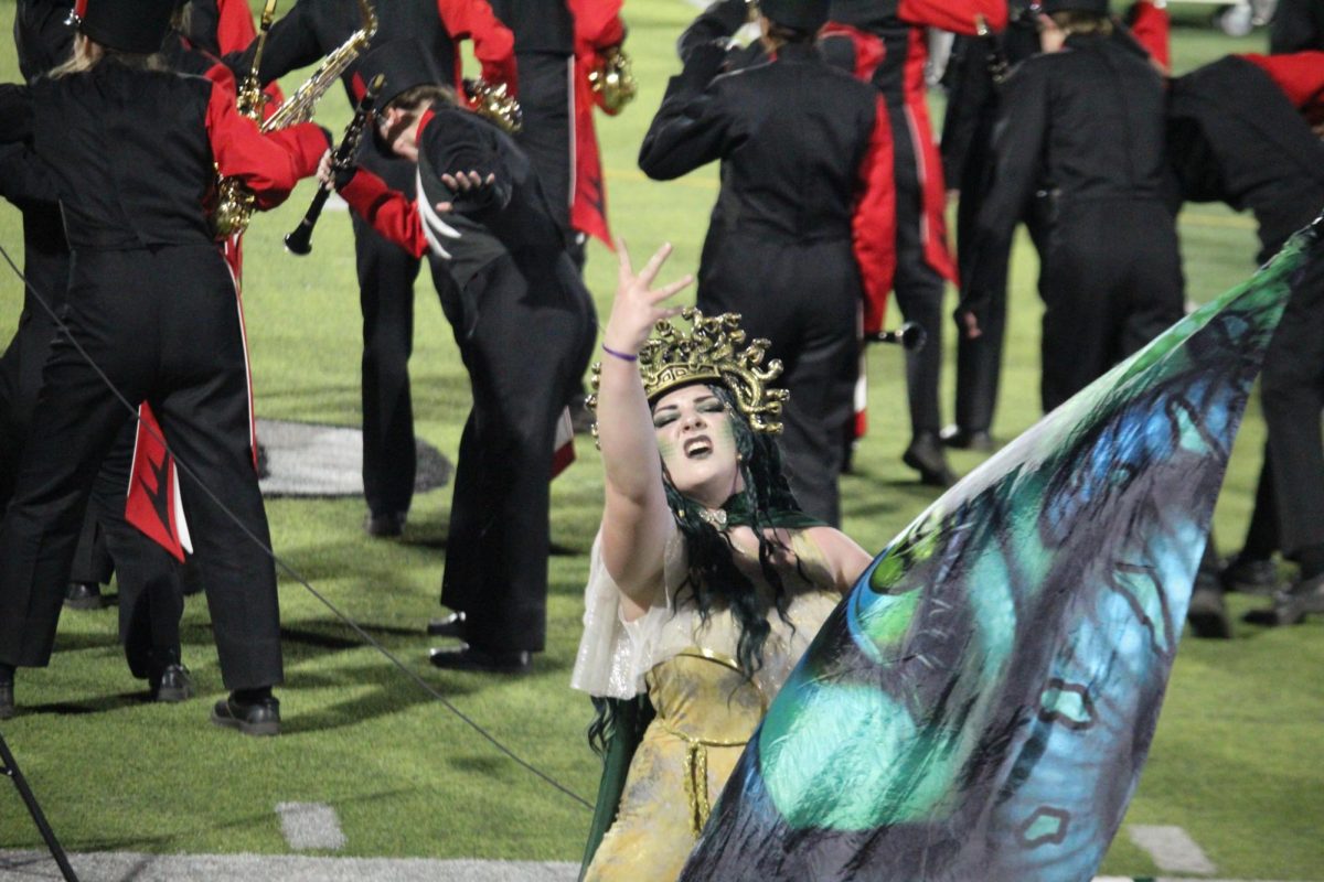 Senior Phoenix Erwin performs as Medusa in the marching band. This took place during the last home football game of 2024.