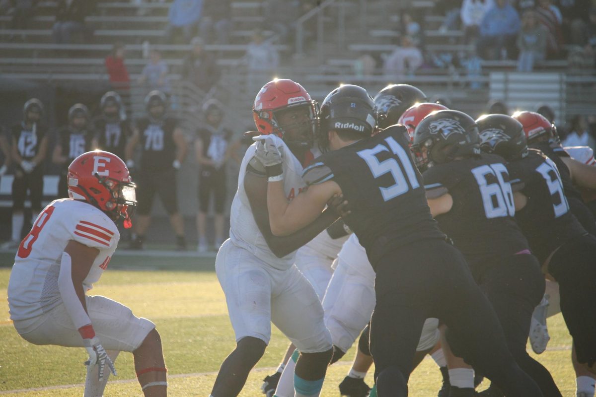 Senior Fon Mofor blocks 51 with a grab and push. 