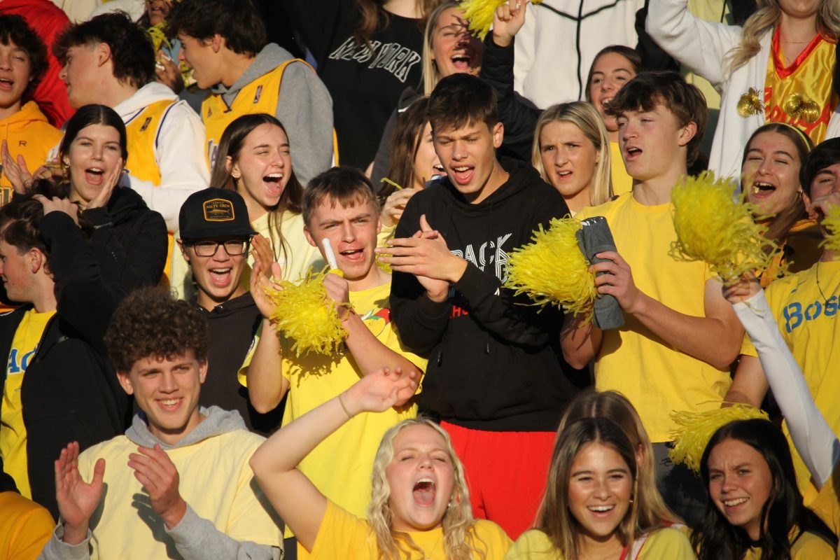 Students cheer loudly for Elkhorn High's touchdown. 