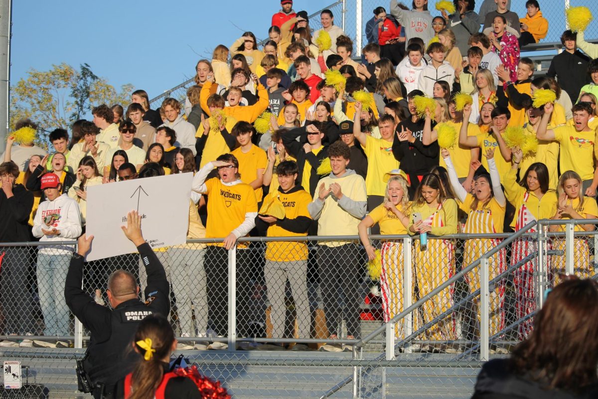 Student section gets hype when officer potter holds up the sign "cheer or go to jail."