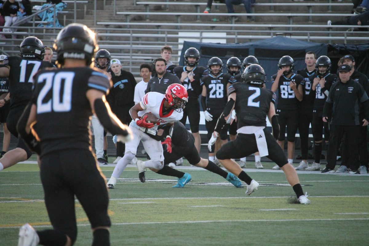 Senior Jayden Moody brings it to the 50 yard line to try to score a touchdown.