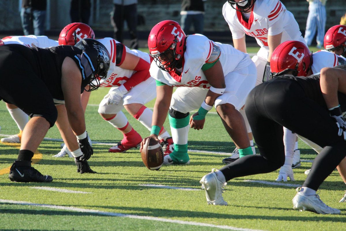 Willie Rush is about the snap the ball starting the next play. Elkhorn played Elkhorn North with a final score of 14-35 which ended Elkhorn's playoff games for the season. 