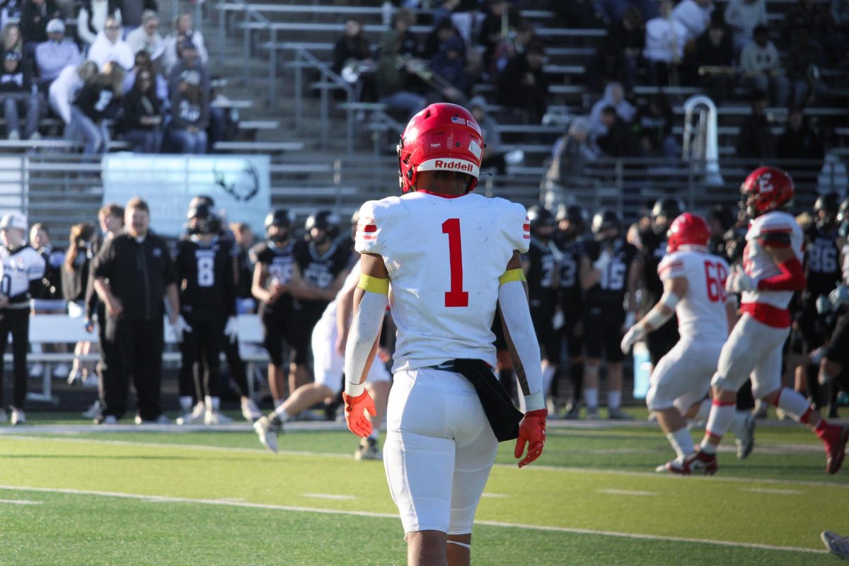 Senior Xander Ardley Jr. walks on the field ready for the play ahead. Elkhorn played Elkhorn North with a final score of 14-35 which ended Elkhorn's playoff games for the season. 