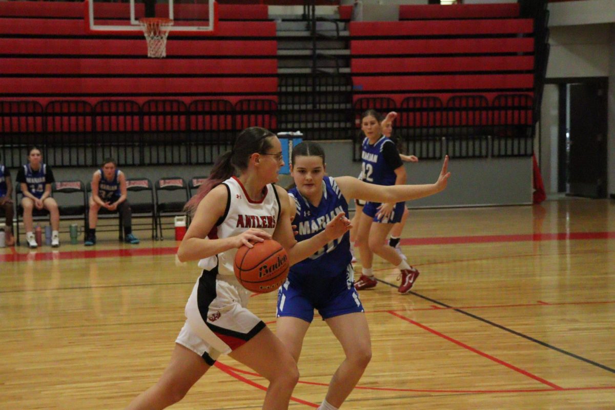 Jumior, Cassidy Muhlbauer, taking the ball to the basket. 