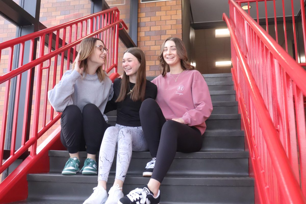 "What A Day" vlog hosts Allyson, Ava and Delaney share a light-hearted moment recapping their day at EHS.