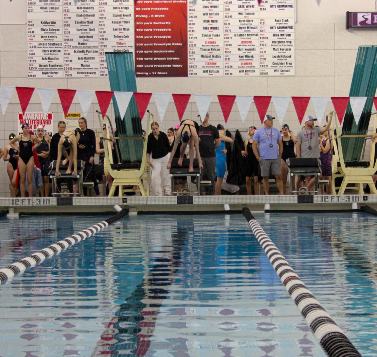 Senior, Teagan Plathe, getting ready to dive for her race. 