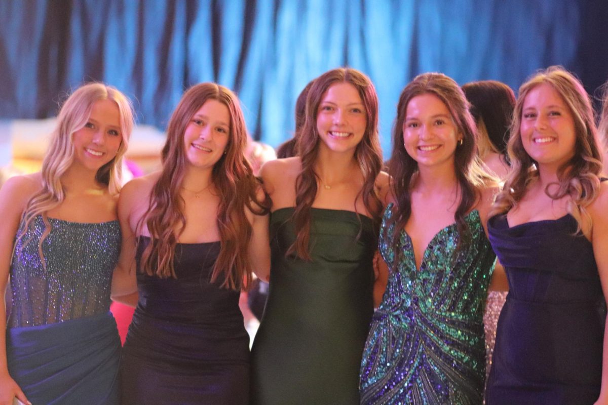 Junior girls all pose for a picture.