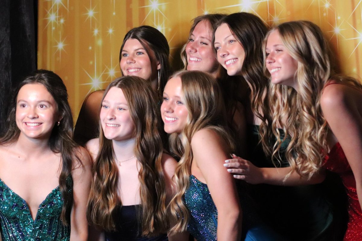 Junior girls pose for a picture.