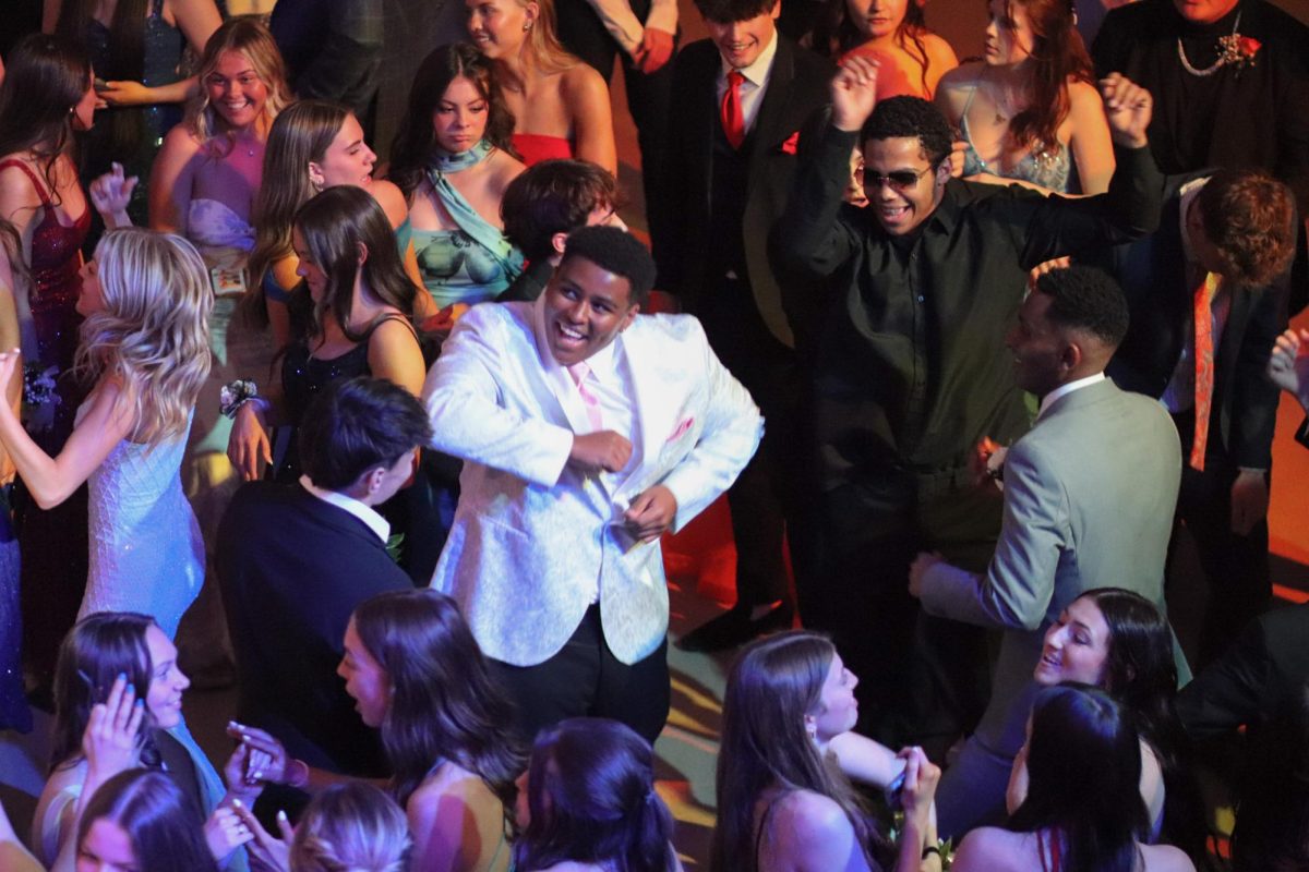 Senior Willie Rush dances with friends at prom. The Prom theme was "At Last I See the Light," and was held on March 29th. 
