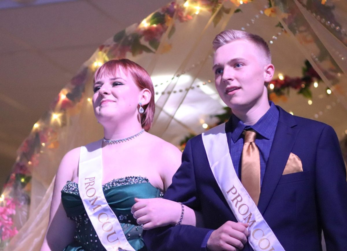 Prom Senior Jarrett Paulson and Senior Nix Erwin enter the dance for coronation.  Paulson was named King and Erwin was named Queen at the dance.