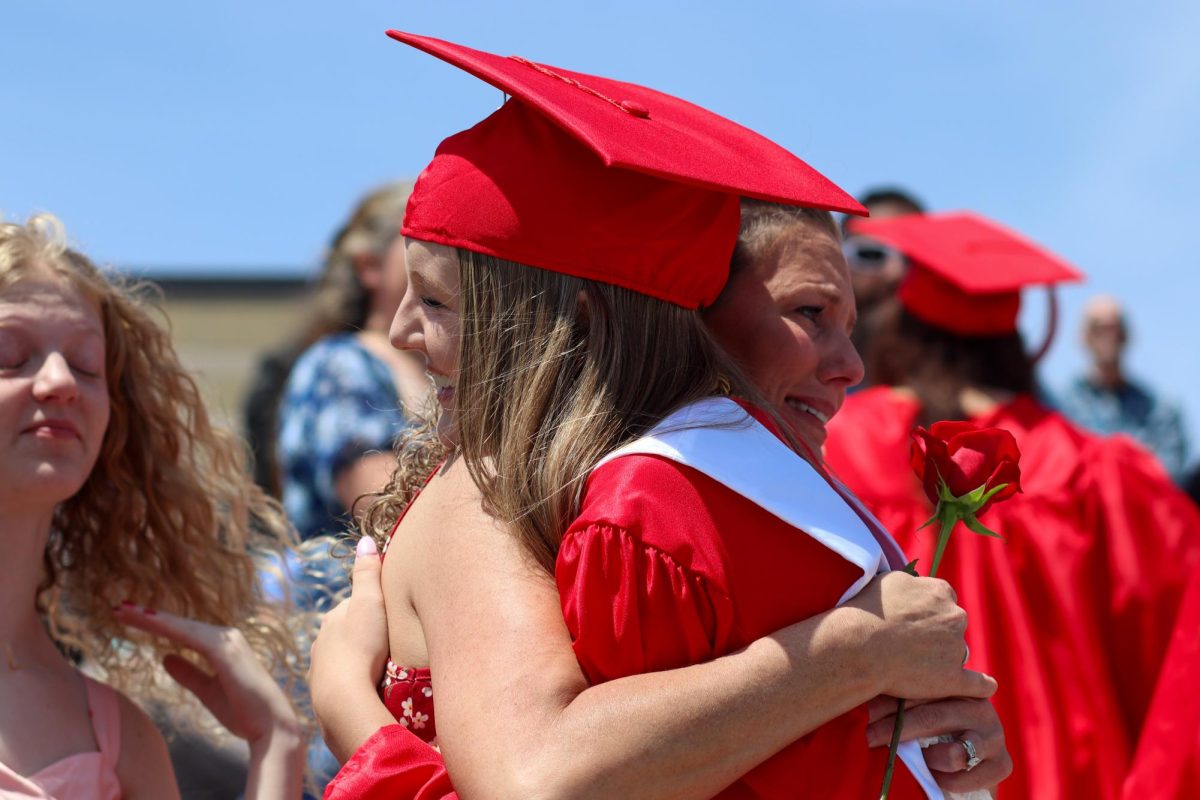 Kelly Knutson hugs family member when graduates went to give their family's their flowers. Graduation was held May 18th.