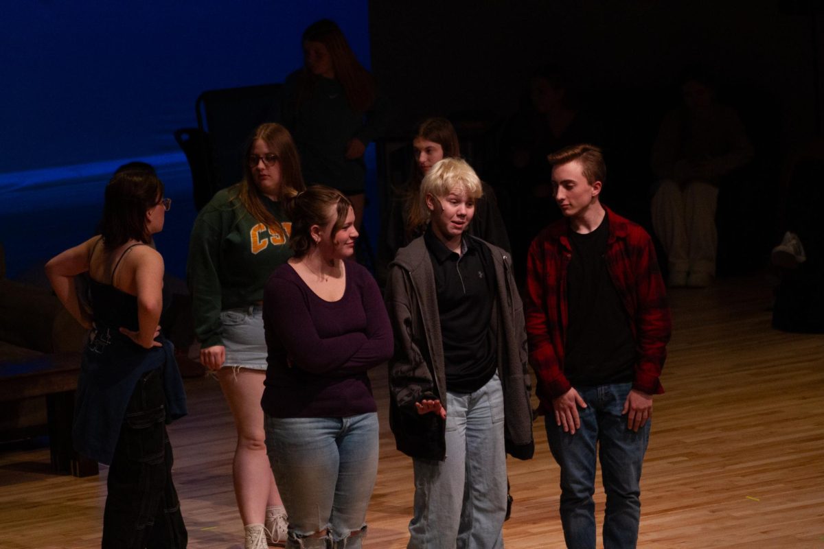 Sophomore Lily Jaworski, Freshman Grace Morrison and Sophomore Kaleb Paulson rehearse a scene from "The Searchers," the EHS spring play.