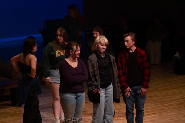 Sophomore Lily Jaworski, Freshman Grace Morrison and Sophomore Kaleb Paulson rehearse a scene from "The Searchers," the EHS spring play.