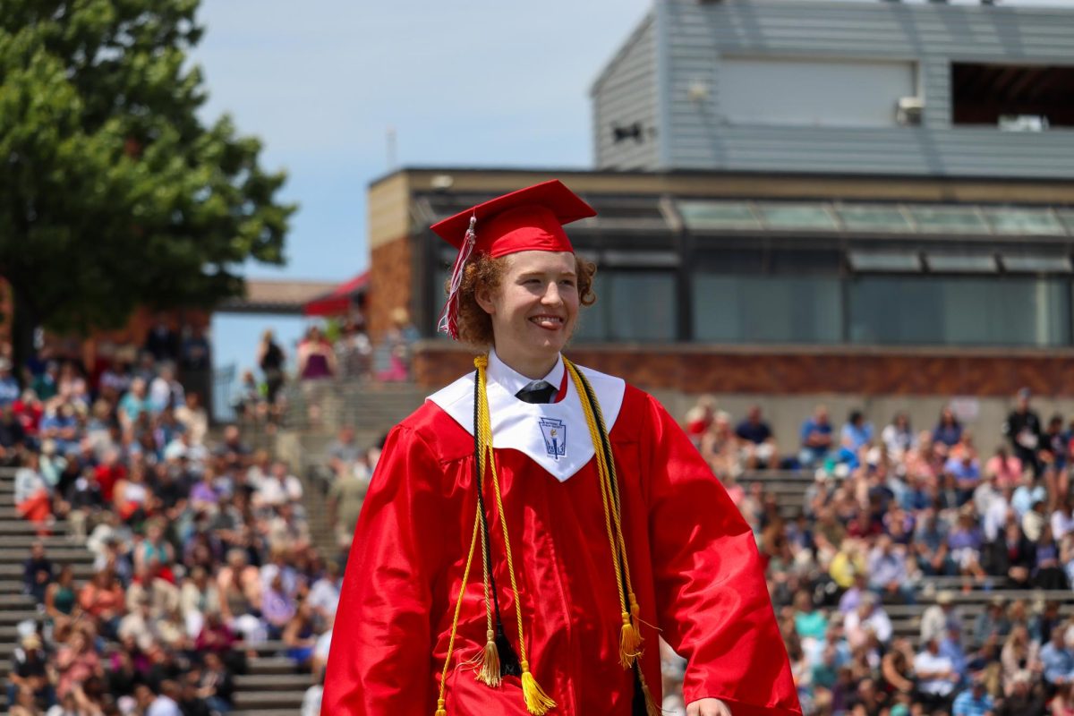 Quinton Raiser sticks his tongue out at family and friends after receiving his diploma. Graduation was held May 18th.