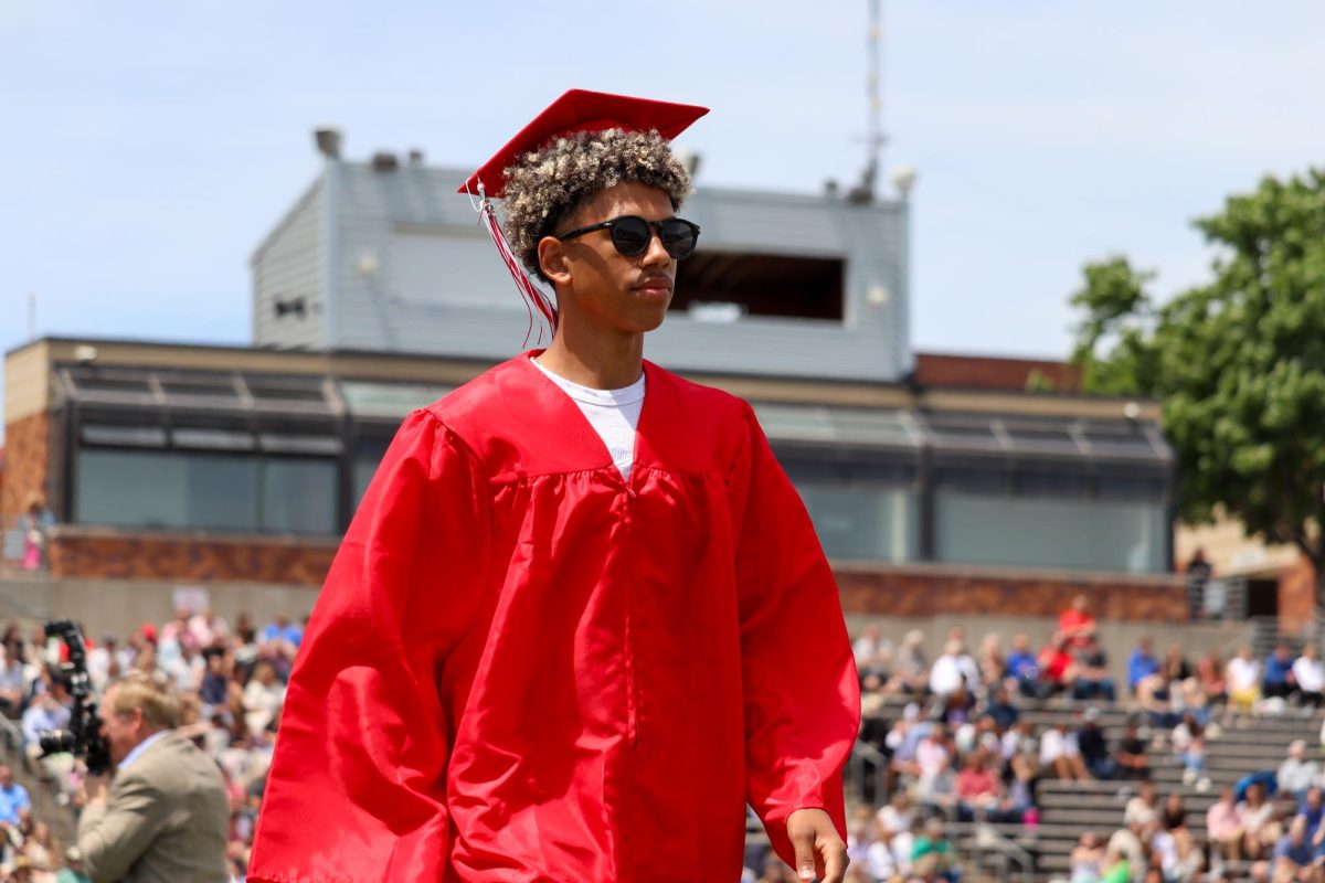 DeShawn Striplin  walks off stage in his shades after receiving his diploma. Graduation was held May 18th. 