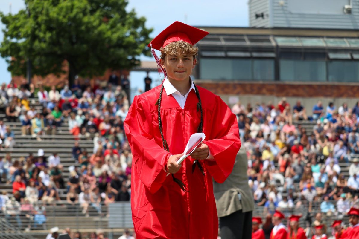 Eric Sutton walks across the stage after receiving his high school diploma. Graduation was held May 18th. 