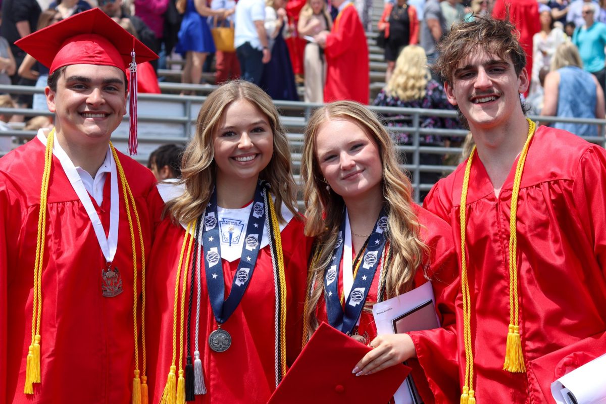 Joseph Herrington, Avery Anderson, Macie Burson, and Timothy Boomgarden pose for a picture after the graduation ceremony. Graduation was held May 18th.