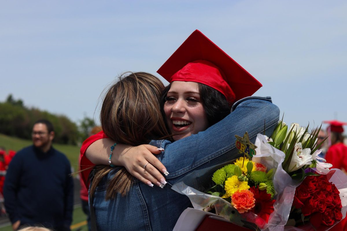 Neveah Hughes hugs Kayla Anderson  after the graduation ceremony ends. Graduation was held May 18th.
