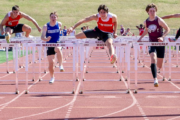 Junior Brody Clevenger clears the final hurdle in the 110 meter hurdle race at the Waverly Invite April 11, 2025. Clevenger recently set the school record in the hurdles.

Photo courtesy of Elkhorn track