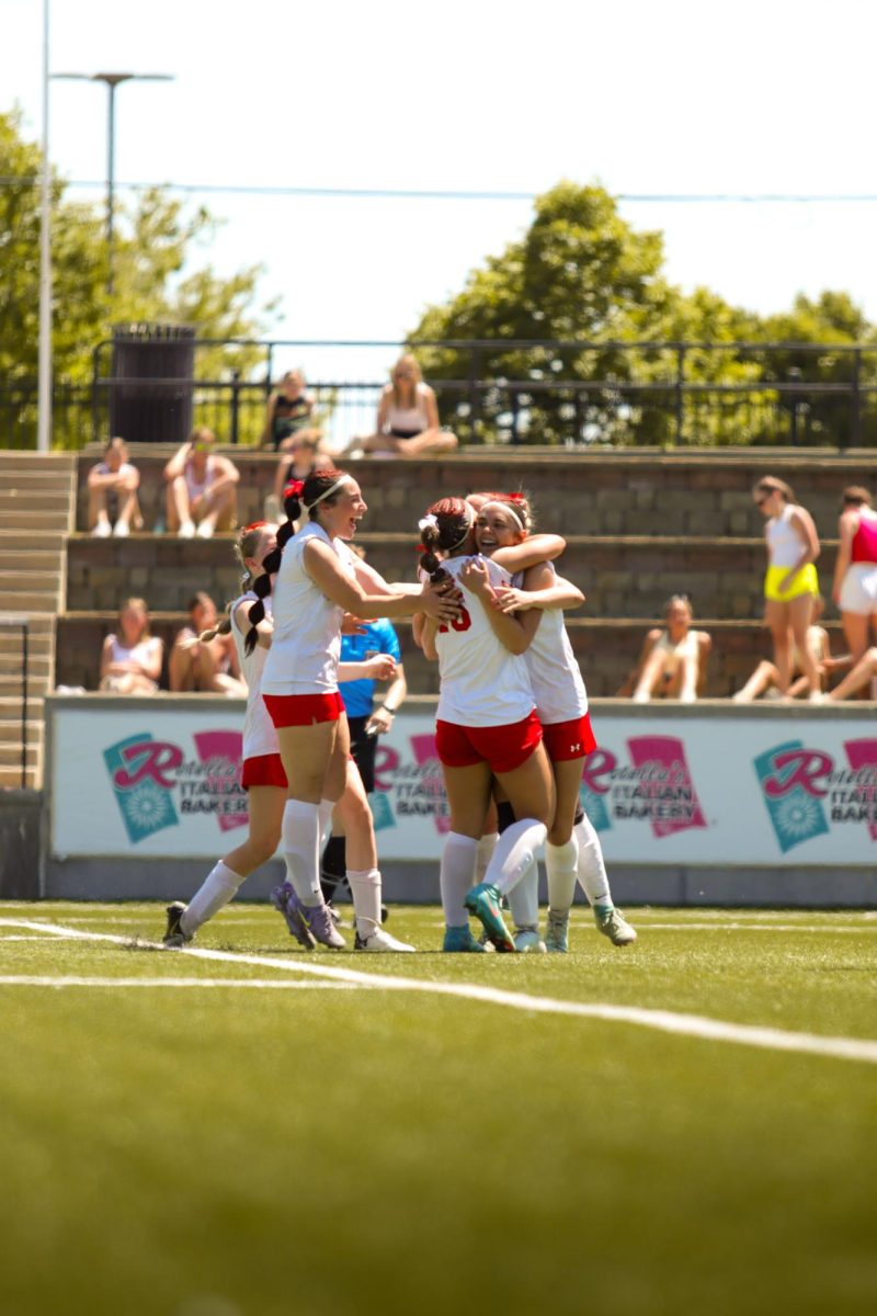 Antlers soccer players celebrate a goal during the state soccer match. The Antlers lost at state 6-2 to Gretna East.