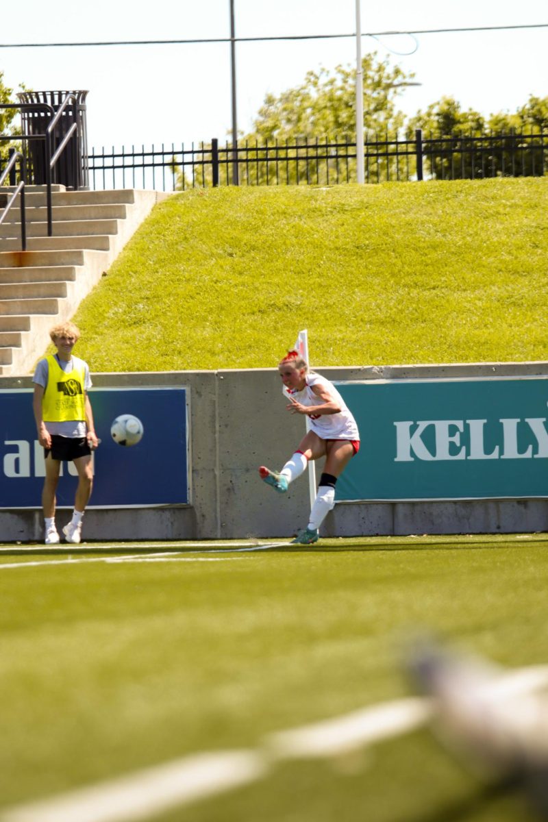 Junior Olivia Thompson drives a corner kick into the box. The Antlers lost at state 6-2 to Gretna East.