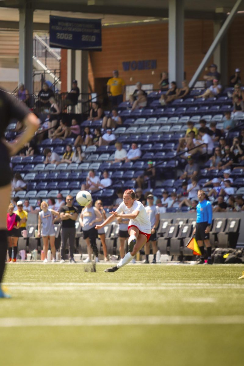 Junior Ella Rodgers drives a shot toward goal in the first round of the state tournament. Elkhorn lost 6-2 to Gretna East.