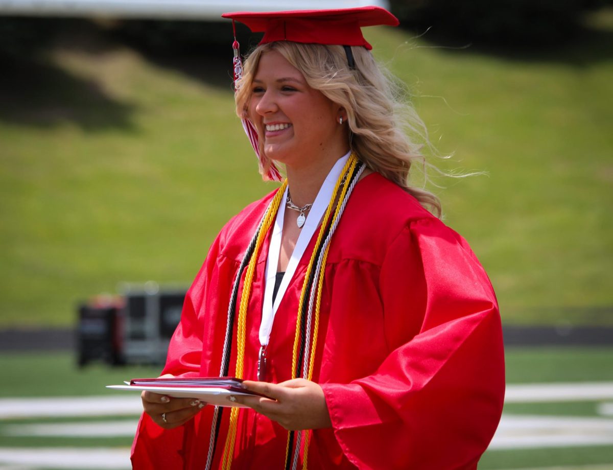 Lauren Vermeerman smiles as she goes to join her classmates after getting her diploma. Graduation was held May 18th. 
