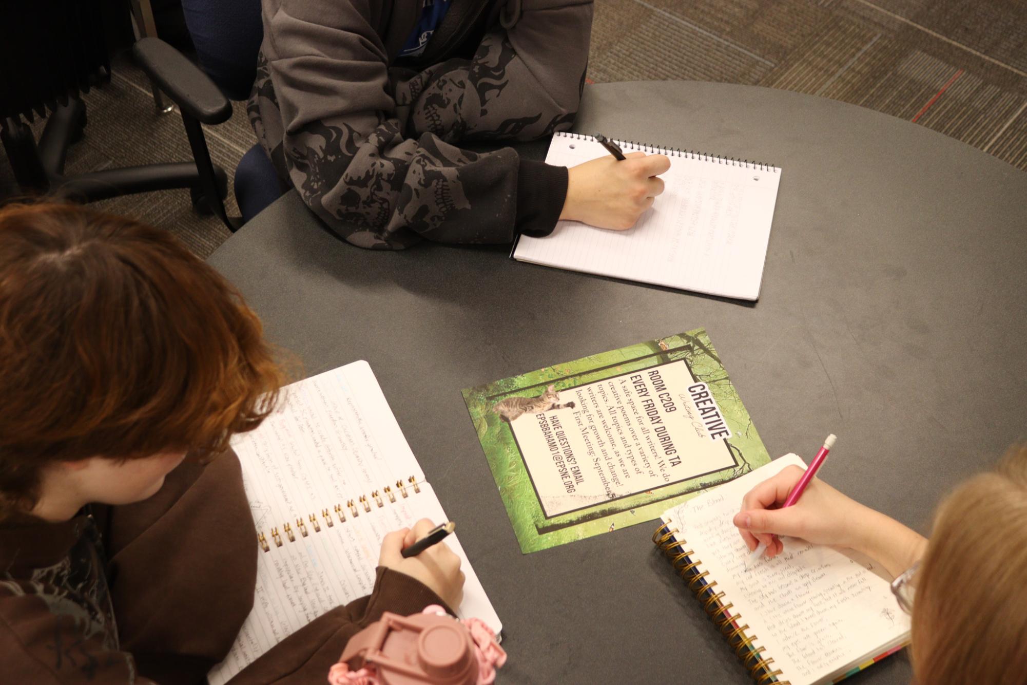 Junior Karl Baham directs a Creative Writing Club meeting. Baham also currates content for the Expressions creative page at Antler.Express.
