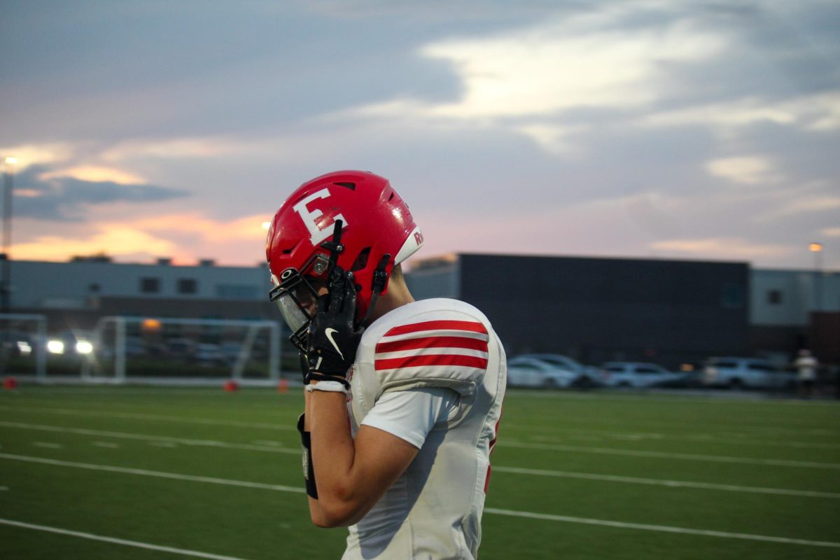Freshman, Jack Pruneda, adjusts his helmet as he returns to the sideline. The Antlers played the Gretna Dragons on Thursday August 28th.