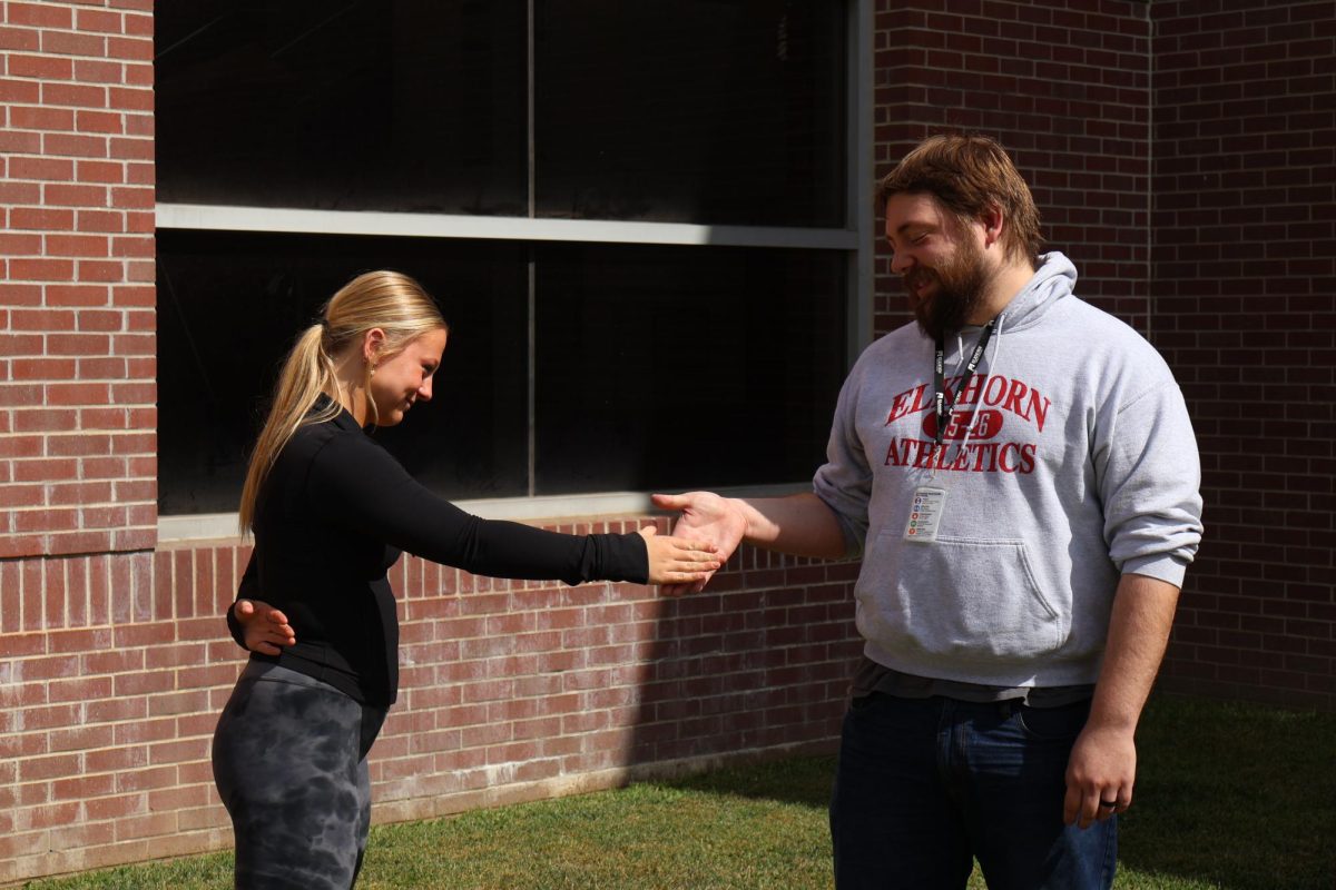 Quinn Westerhaus and Mr. Boyle shaking hands before the Oreo competition