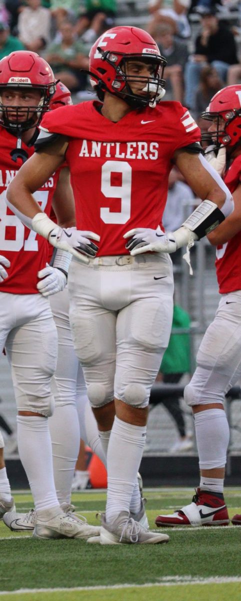 Senior Reid Stec breaks the huddle during the Gretna game. Stec earned Antler of the Week Honors for his performance.
