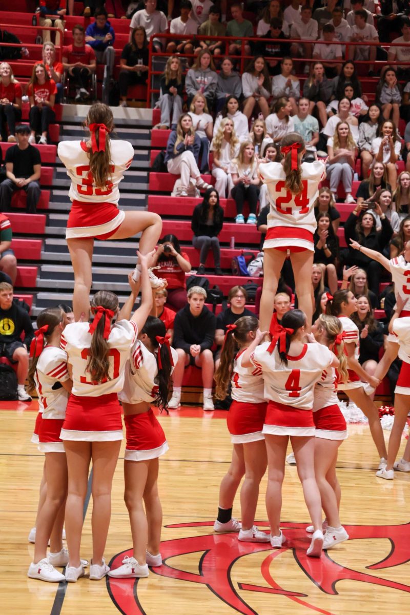 The 2025 Cheer Team performing at the Homecoming Pep Rally. 
