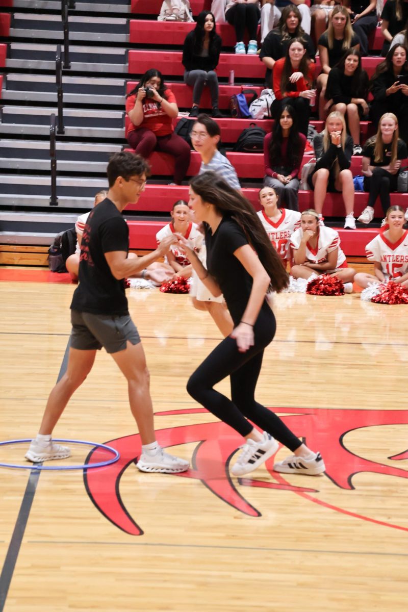 Seniors Finn Hartman and Megan Erdkamp face each other in the Homecoming court 