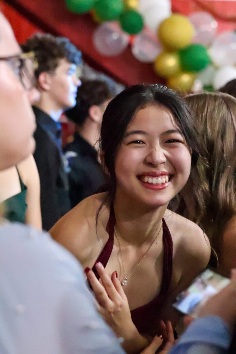 Ronna Tu smiles and poses for the camera while being around friends at homecoming. Homecoming took place on Sept. 20th, 2025.