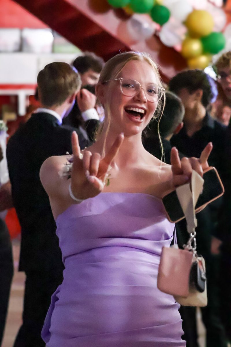 Junior Chloe Wilson flashes an "Antlers up" hand sign. Homecoming took place on Sept. 20th, 2025.