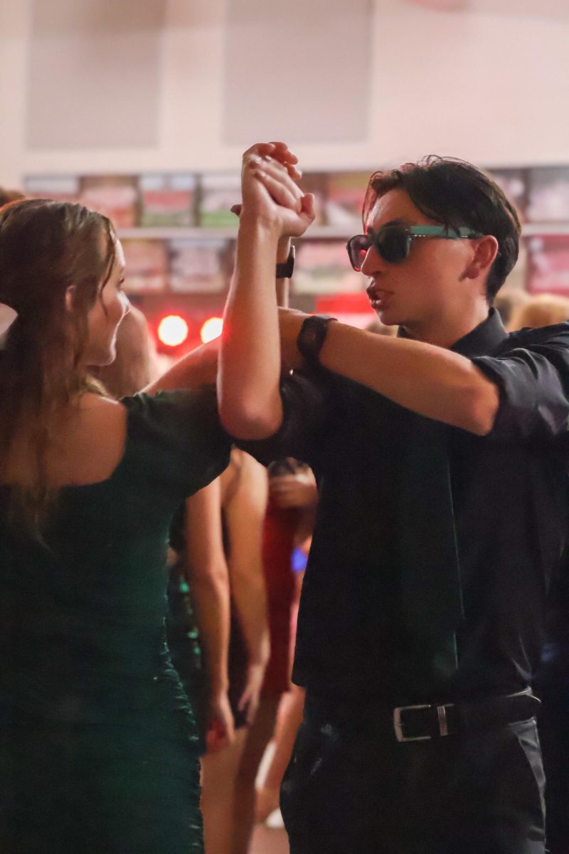 Senior Ivan Ratnapradipa dances with his outside homecoming date. Homecoming took place on Sept. 20th, 2025.