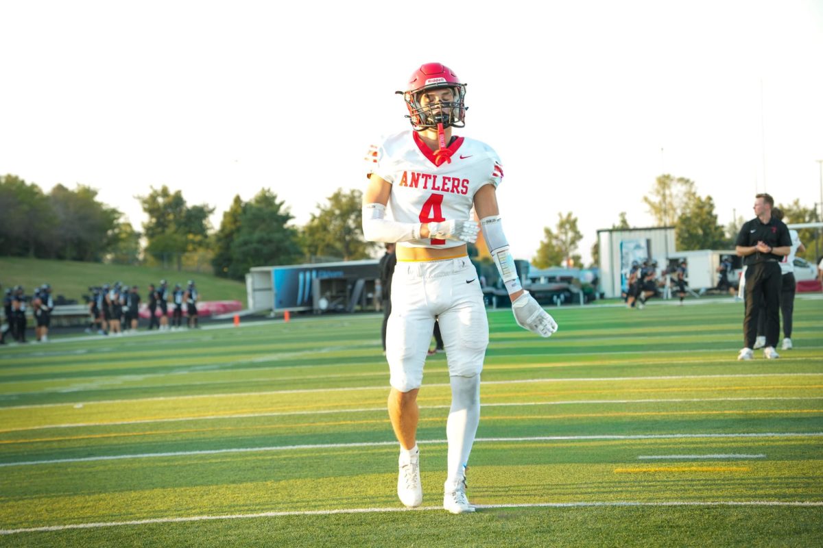 Antler wide receiver Matthew Ott warming up before the game vs. Elkhorn North. 