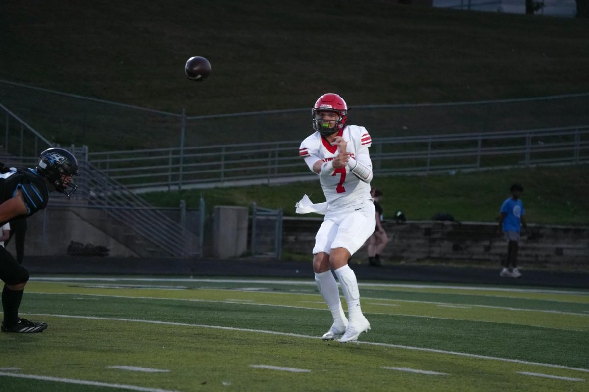 Junior quarterback Baron Clevenger throwing the ball to an open man down the field for an Antler first down. 