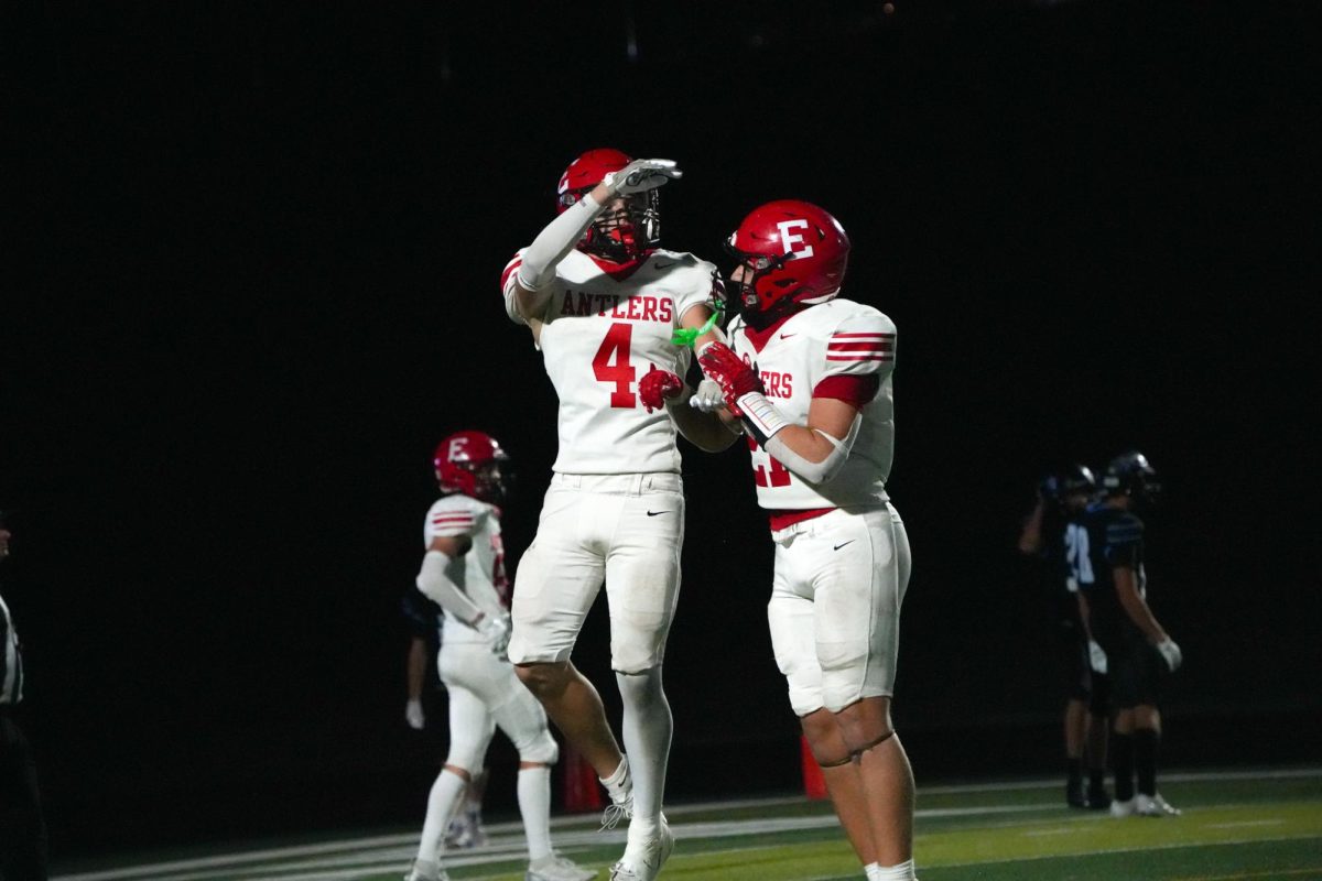 Junior Matthew Ott and sophomore Maddox Seitz celebrating after a touchdown by the Antlers. 