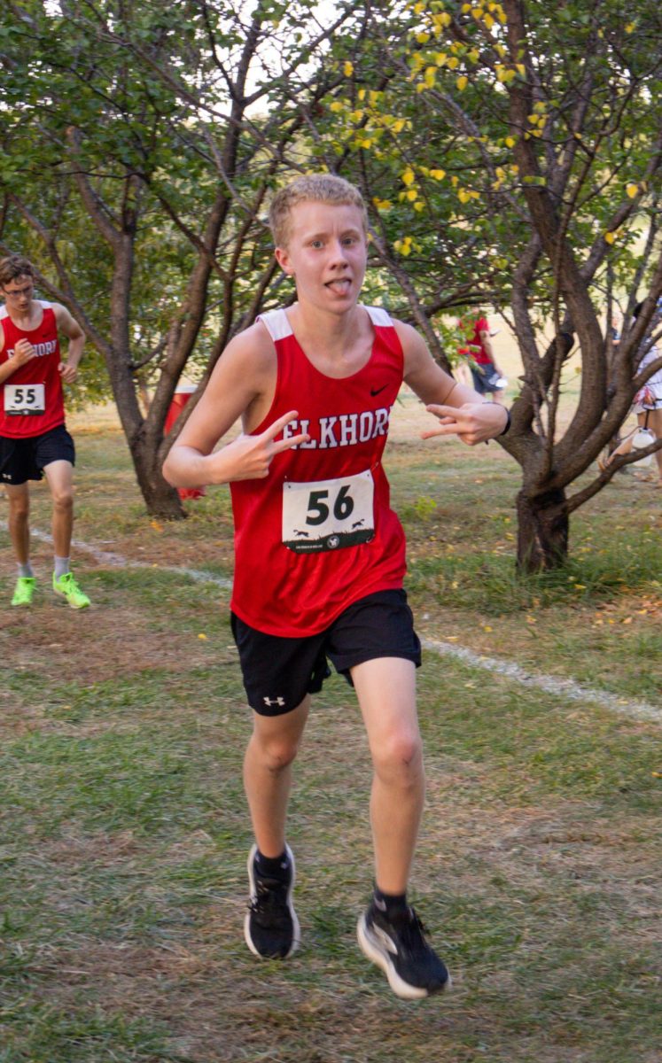 Sophomore Brenden Fisher posing for the camera during his third kilometer of his Boys Town Invite 5k race. Fisher would end up running a final time of 22:12 at the invite.
