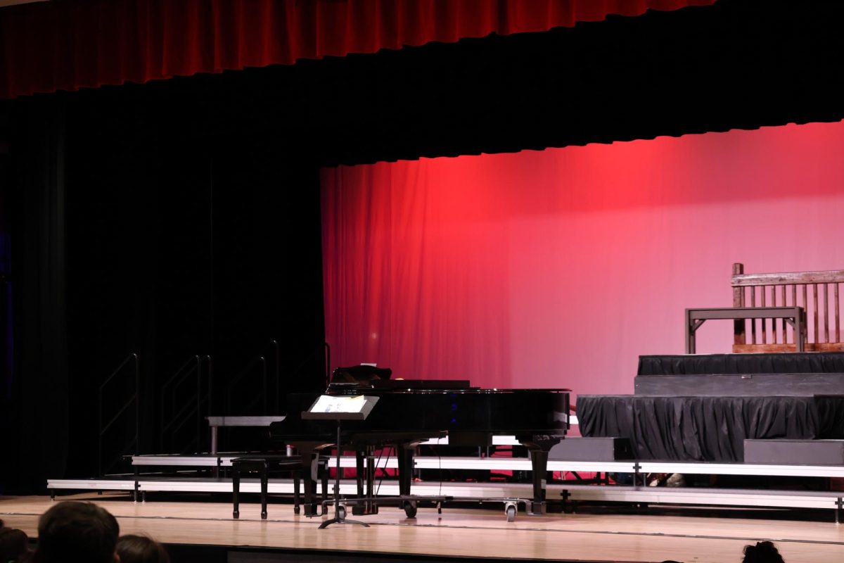 Moments before the choir students head out on stage to perform their first concert of the year,