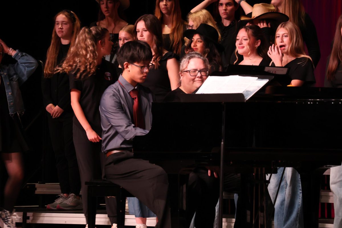 Sophomore Raymond Si plays a duet with Gena Fritz. He plays the song Hoe Down arr by Tom Porter.