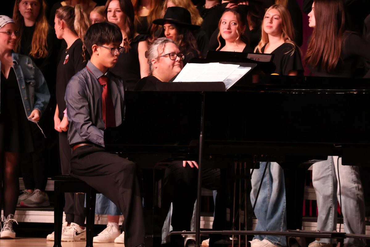 Sophomore Raymond Si plays a duet with Gena Fritz. He plays the song Hoe Down arr by Tom Porter.
