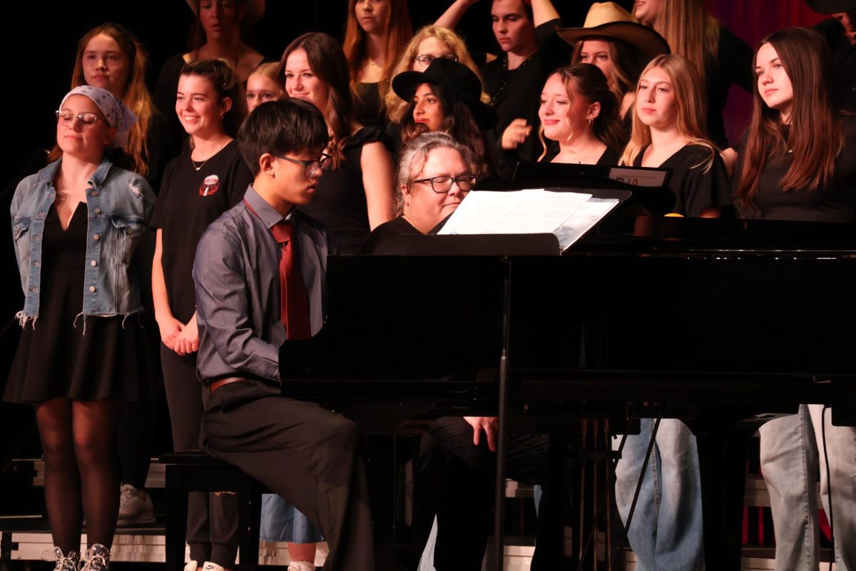 Sophomore Raymond Si plays a duet with Gena Fritz. He plays the song Hoe Down arr by Tom Porter.