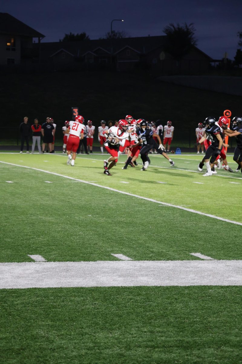 Jameson Hill running towards the endzone after intercepting the ball