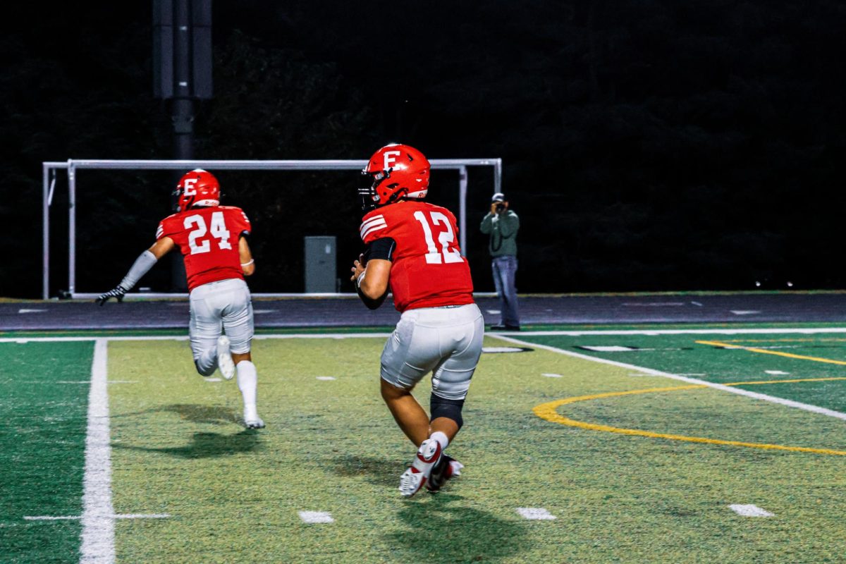 JV quarterback Sophomore Oliver Weyhrich looks to pass the ball in a game against the Bennington Badgers. 