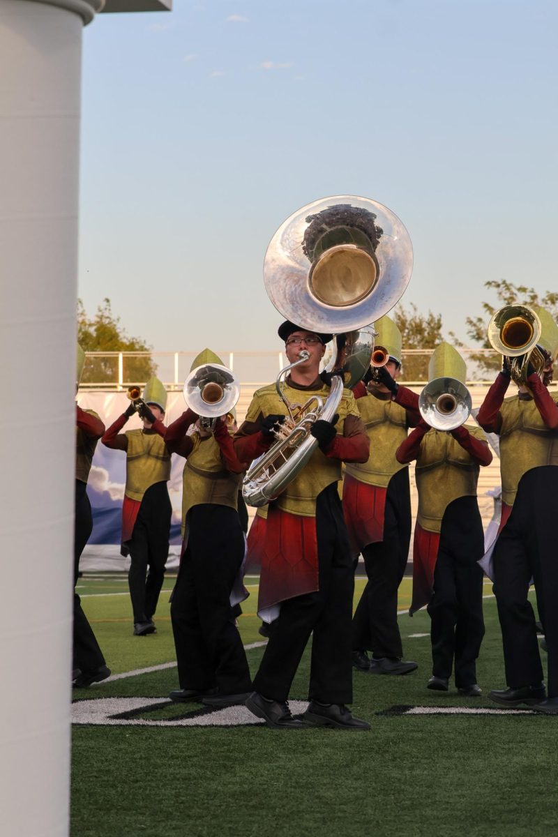 Sophomore Jackson Braughton plays sousaphone while he marches. Elkhorn marching band performed on Oct. 11th, 2025.
