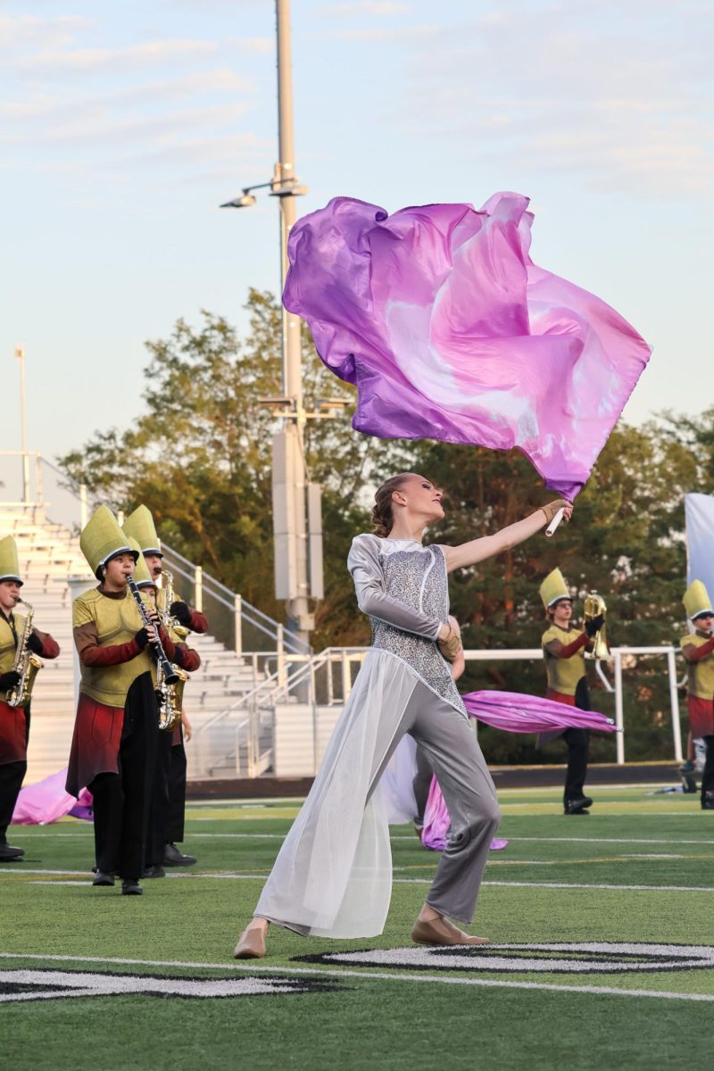 Sophomore Evan Carlson performs duet on the sounds of excellence field. Elkhorn marching band performed on Oct. 11, 2025
