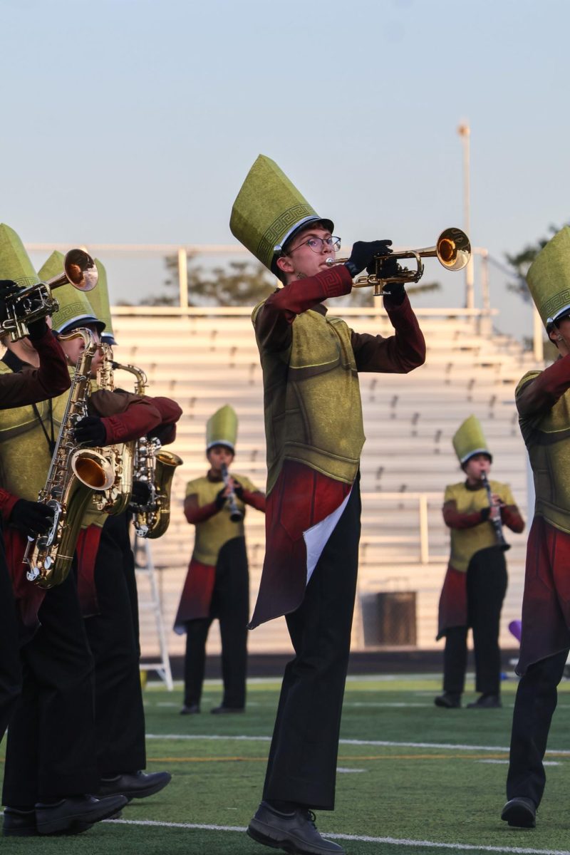 Senior Max Underwood plays his trumpet during the show. Elkhorn marching band performed on Oct. 11th, 2025.