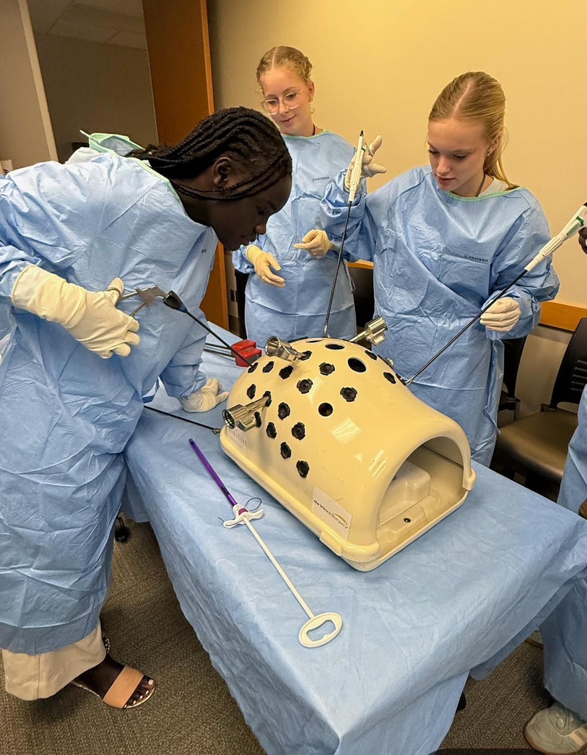 Students practice surgical skills at the DOVE Days surgery mock trial. DOVE Days is a program that gives students a hands-on career exploration of the medical field.